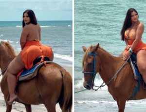 Modelo plus size cavalga na praia exibindo atributos gigantescos